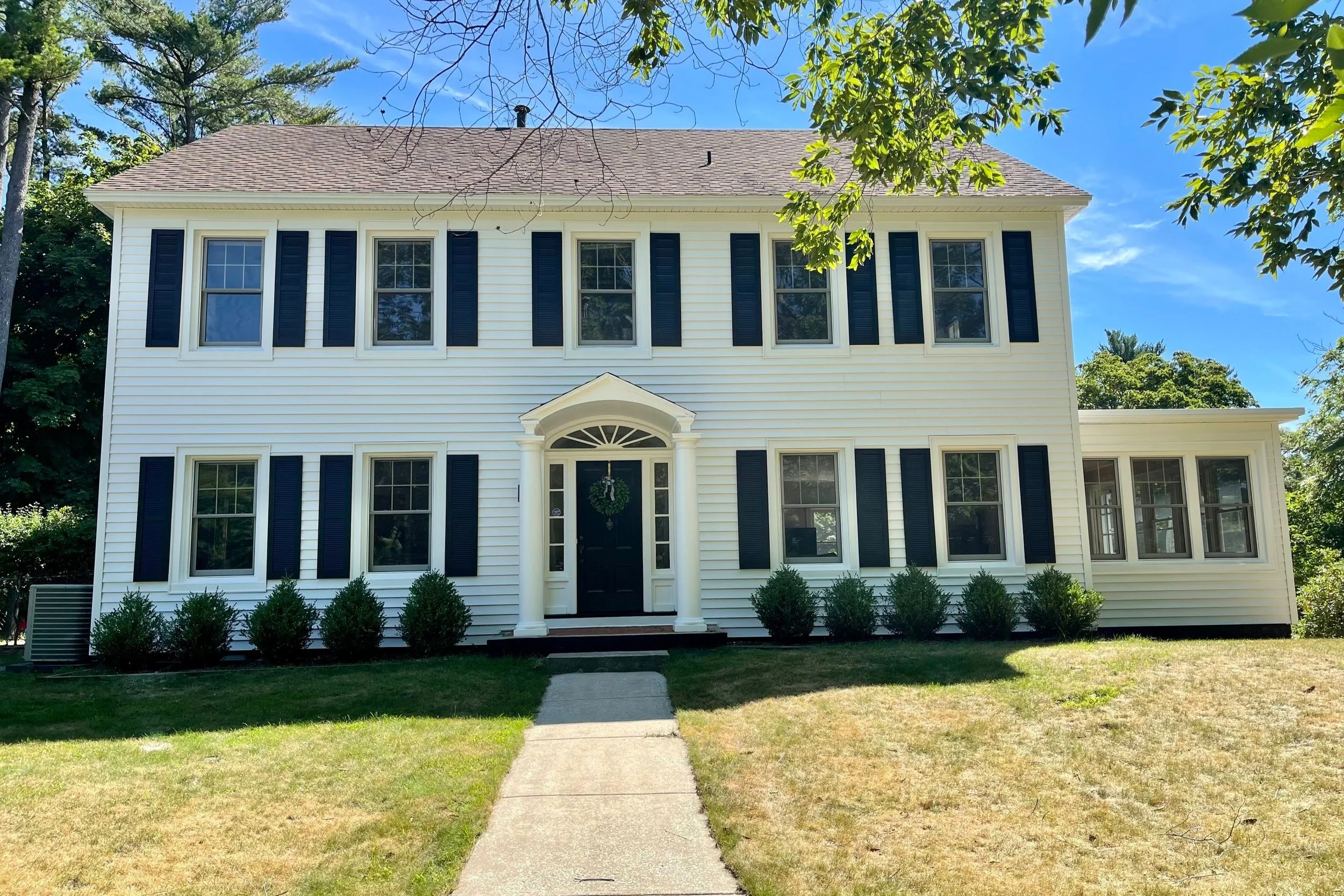 White colonial home exterior painted by Third Coast Painting